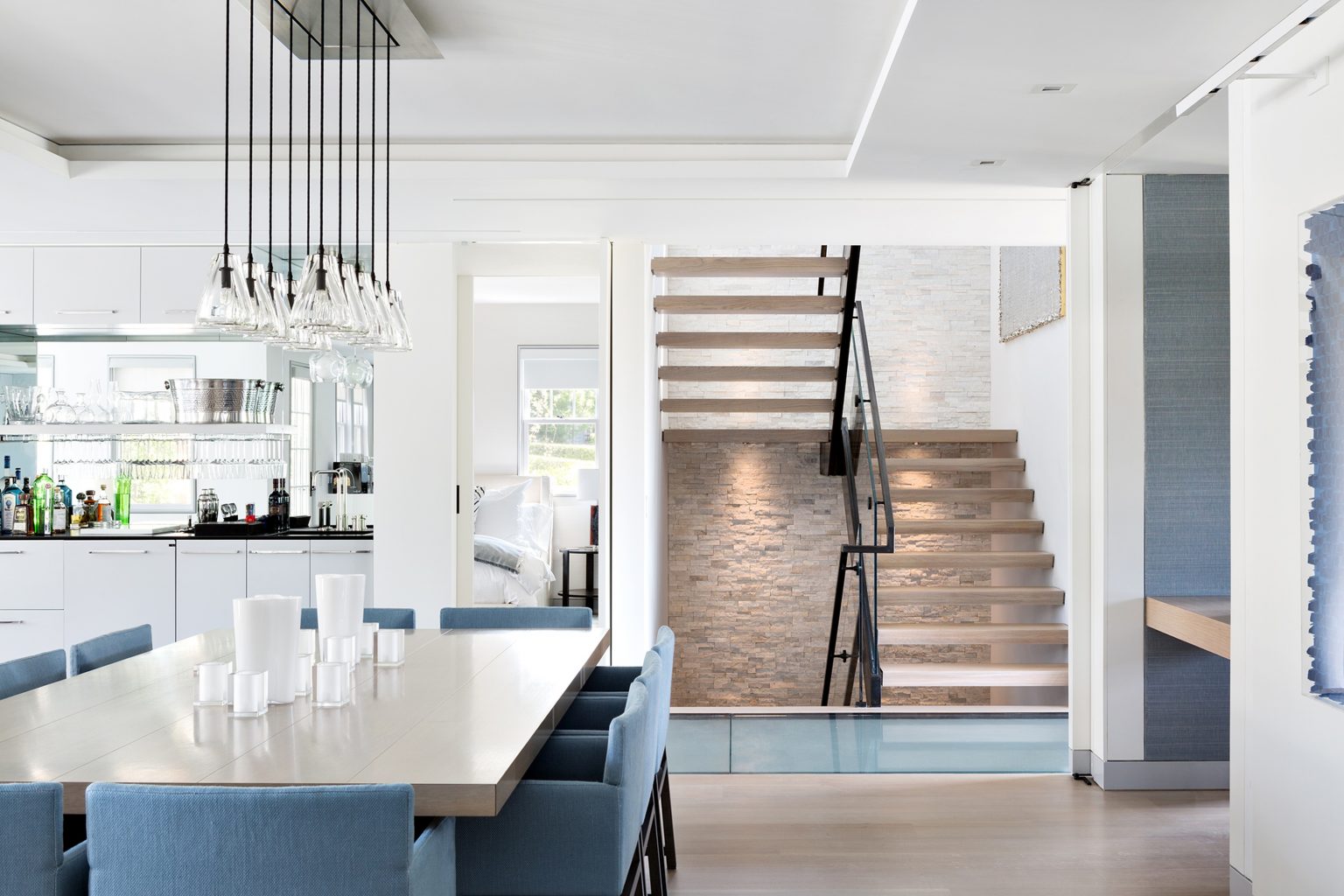 modern-open-plan-dining-room-with-floating-stairs